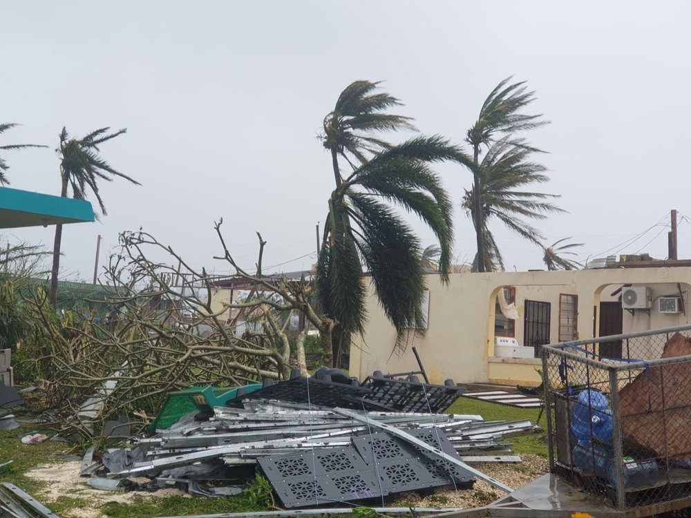Debris covers the ground in Saipan after a super typhoon with ferocious winds and relentless rains, shredded tin roofs and forced residents to take cover from flying tree limbs. (AP)