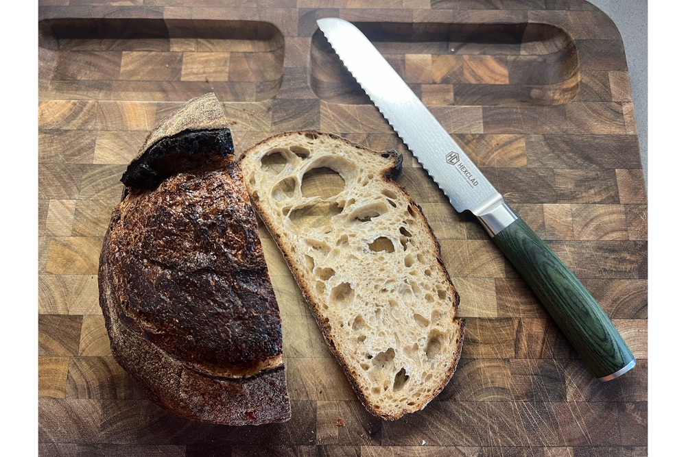 The knives are paired with a sleek wooden block (Kate Ng/The Independent)