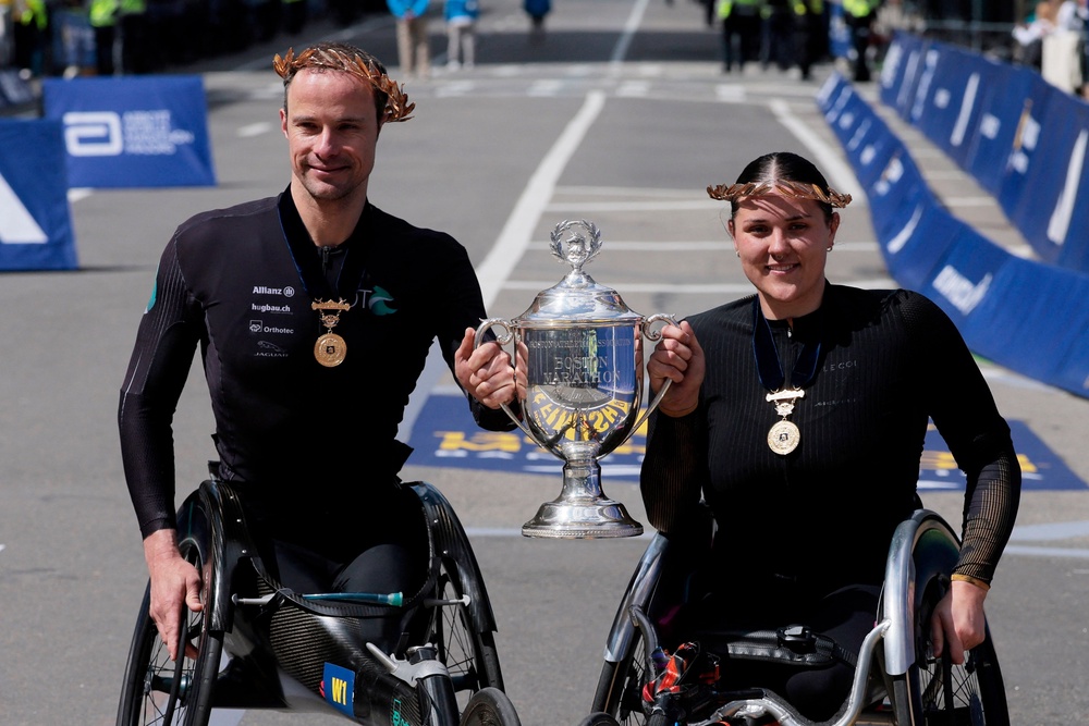 Marcel Hug and Eden Rainbow-Cooper claimed the wheelchair titles (Reuters)