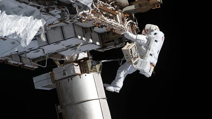Artemis II astronaut Victor Glover works during a spacewalk in January 2021 wearing an old spacesuit (NASA)