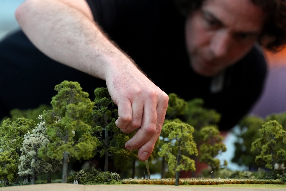 The finishing touches being applied to a model of St James’s Park in London during a preview for the Queen Elizabeth exhibition at the British Museum (Ben Whitley/PA) (PA Wire)