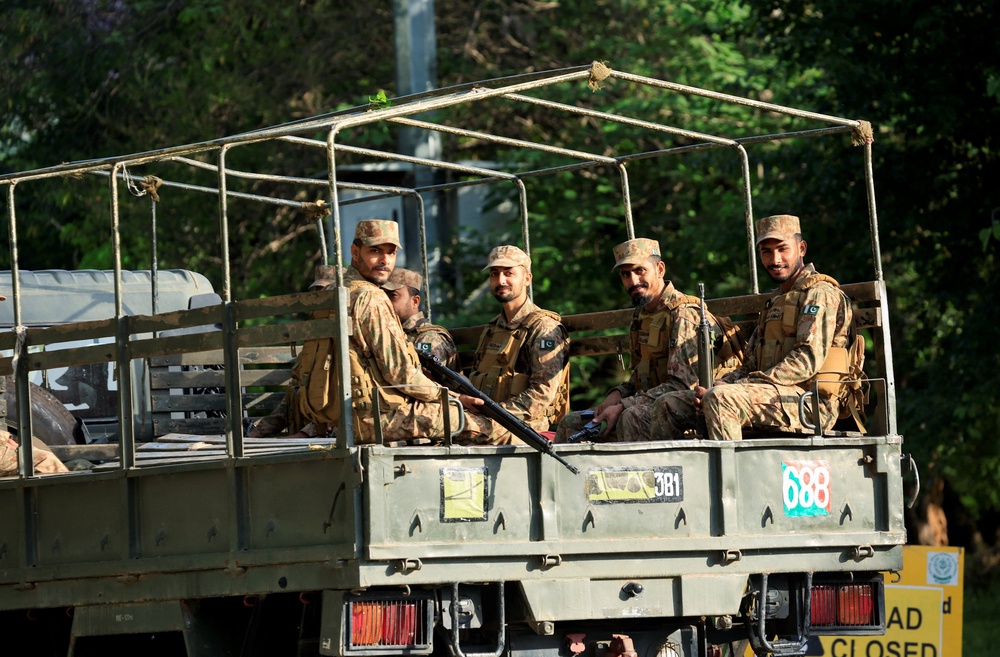 Pakistani army soldiers patrol at D Chowk near the President's House, as Pakistan prepares to host the U.S. and Iran for the second phase of peace talks in Islamabad, Pakistan (Reuters)