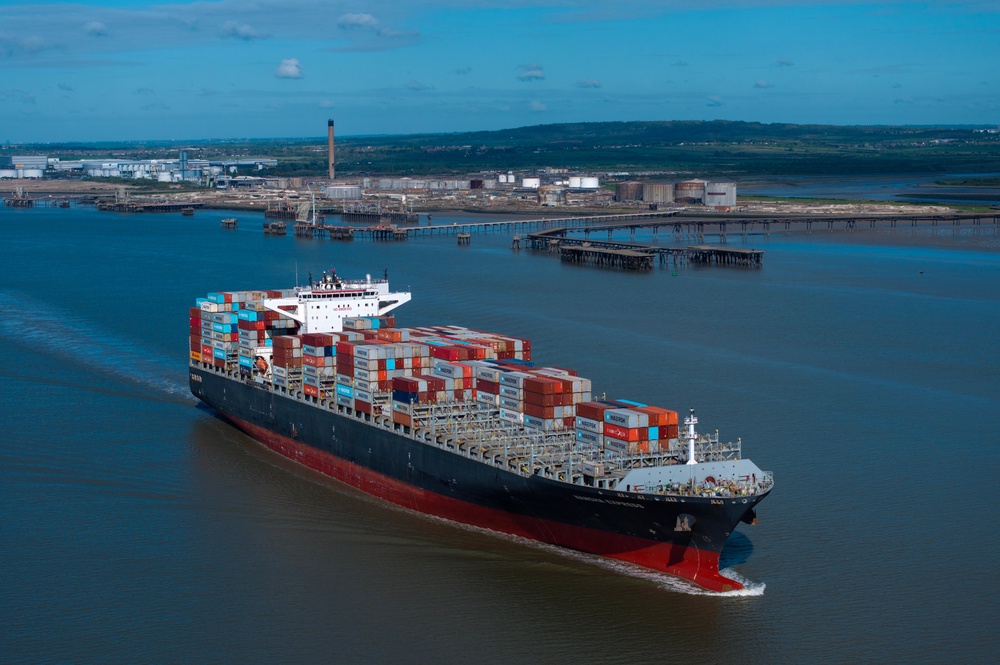 Container ship Nansha Express makes its way towards Antwerp on the River Thames past the The Oikos bulk liquid fuel storage facility (Getty)