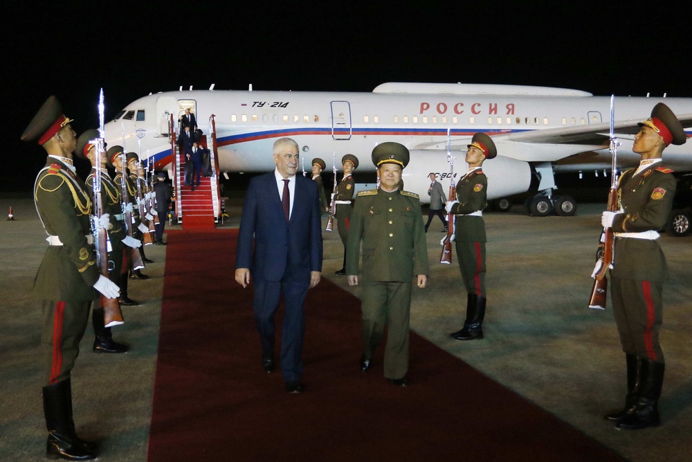 Russian interior minister Vladimir Kolokoltsev walks with North Korean public security minister Pang Tu Sop on his arrival at the Pyongyang International Airport in Pyongyang (AP)