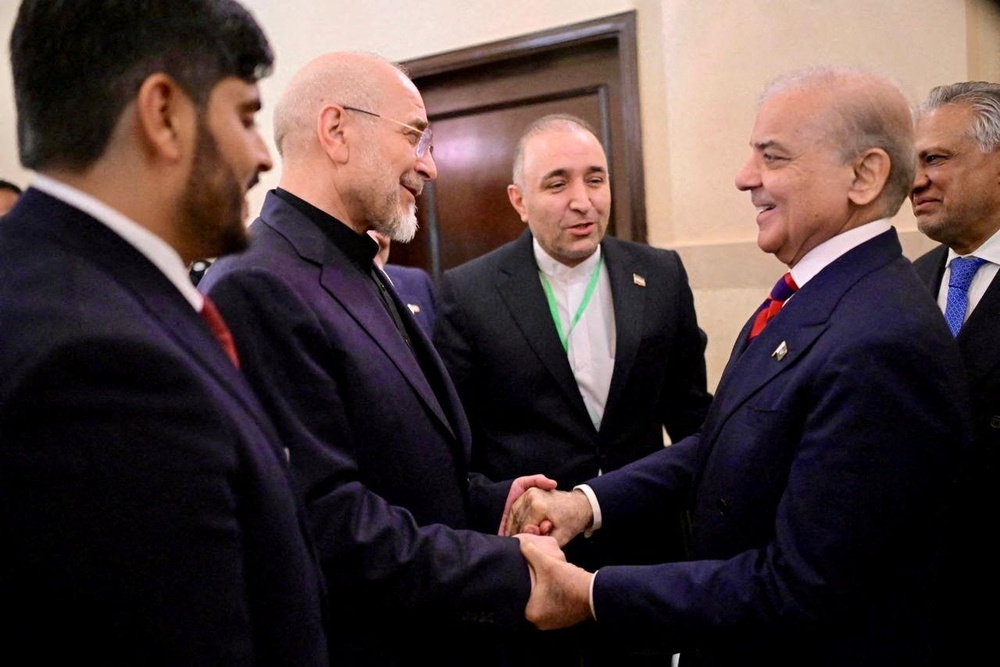 Pakistani prime minister Shehbaz Sharif (right) meets with Iranian parliament speaker Mohammad Bagher Ghalibaf (left), in Islamabad, Pakistan, on 11 April (Reuters)