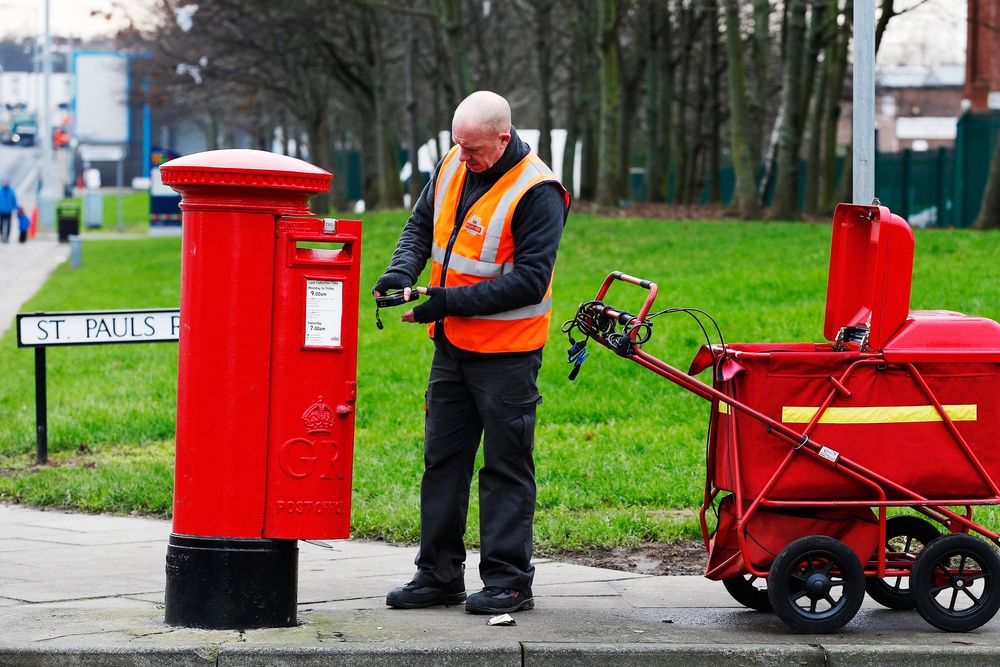 Royal Mail has pledged to meet new postal delivery targets by May next year (PA)