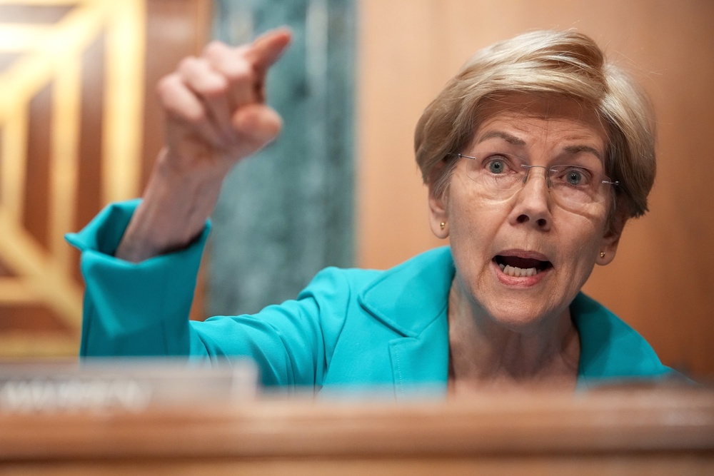 Senate Banking Committee’s top Democrat Elizabeth Warren grilled Warsh on his assets and loyalty to Trump (Getty)