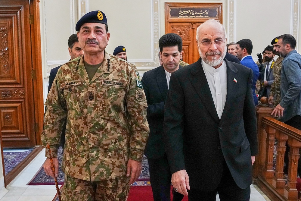Mohammad Bagher Qalibaf, right, has warned Iran is ready to reveal ‘new cards on the battlefield’ (Hamed Malekpour/AP) (AP)