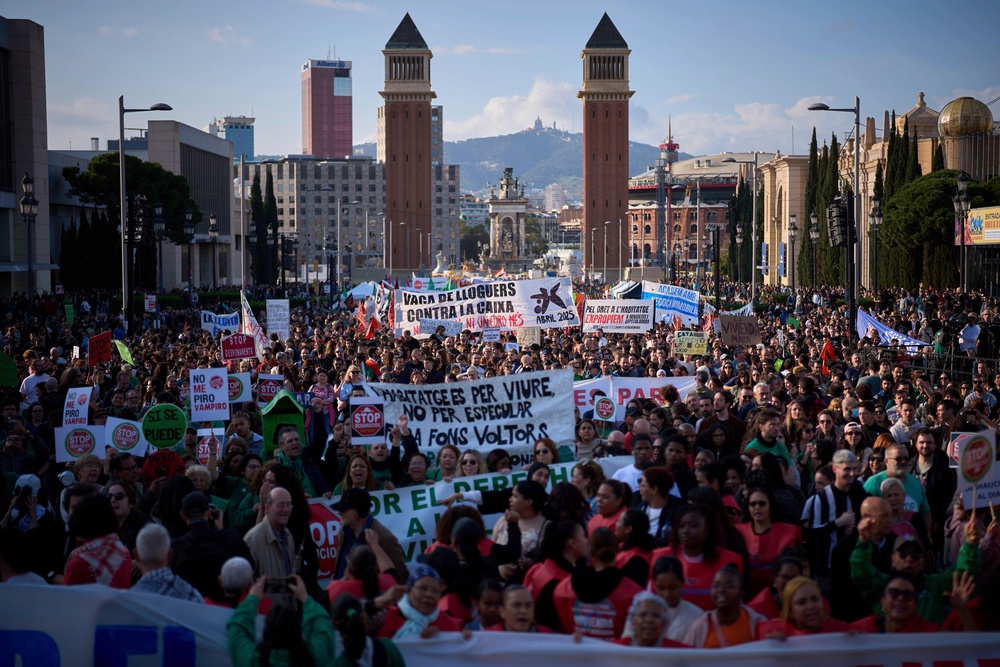 People gather during a demonstration to protest high housing costs in Barcelona, Spain. (AP)