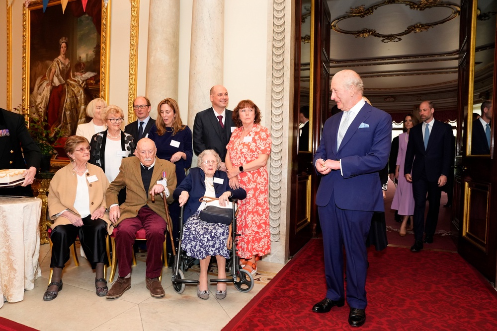 King Charles III meets (front left-right) 100 year-olds Joan Illingworth, John Jervois and Mary Wood during a reception at Buckingham Palace in London to celebrate the 100th anniversary of Queen Elizabeth II's birth (PA)