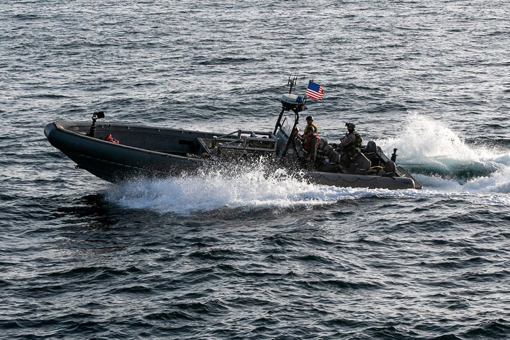 U.S. forces patrol the Arabian Sea near M/V Touska, April 20, as the Iranian-flagged vessel's container cargo is searched after U.S. Marines boarded and seized the ship when it attempted to violate the U.S. naval blockade (US Centcom)