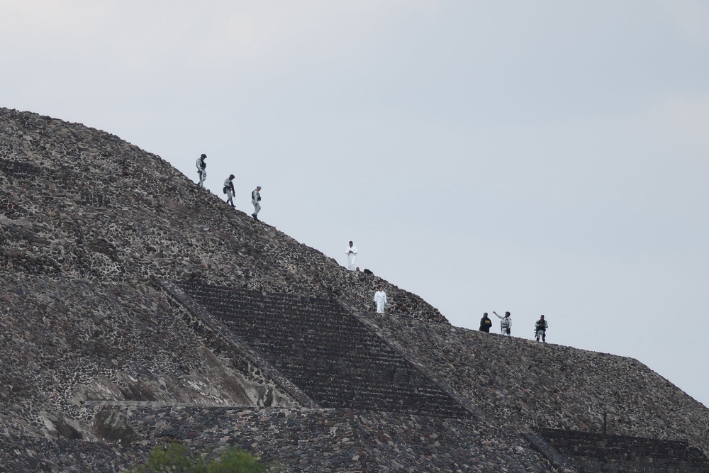 Police and forensic workers on the pyramid (AP)