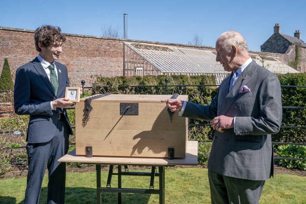 Blue Peter presenter Joel Mawhinney presented the King with the badge (Jane Barlow/PA) (PA Wire)
