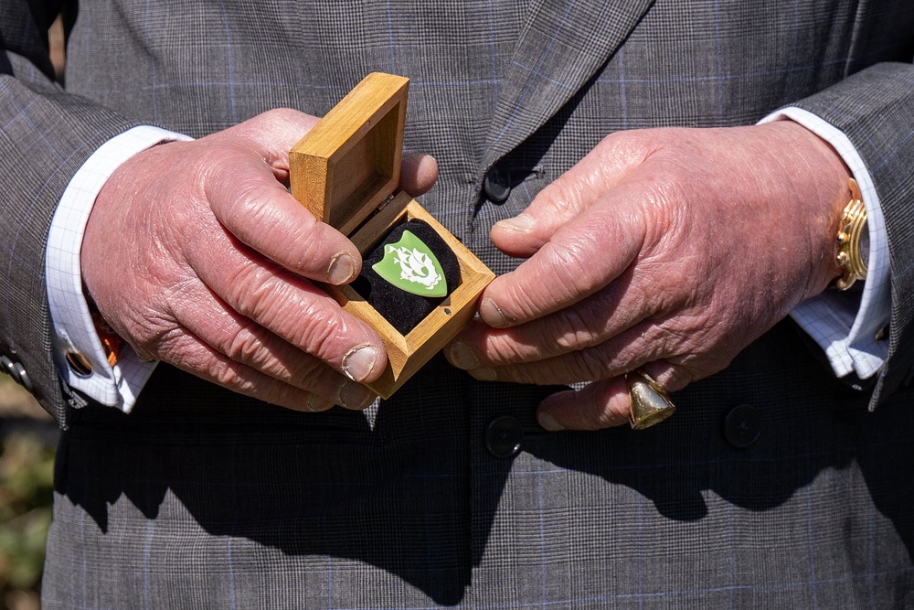 King Charles III holds a Blue Peter Green Badge presented to recognise his work to protect nature and the environment (AFP/Getty)