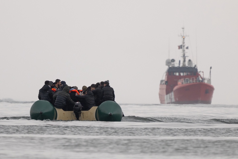 Migrants sit atop a dinghy before attempting to sail into the English Channel on April 01, 2026 in Gravelines, France. (Getty Images)