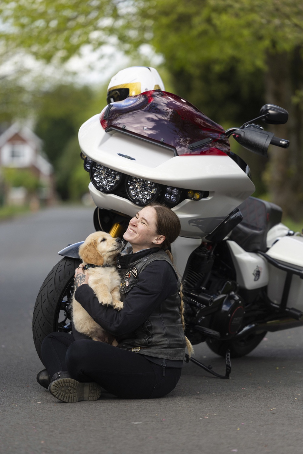 Kian meets Harley-Davidson rider Emma Poole, as the charity Guide Dogs appeals for more motorbike riders to volunteer as puppy raisers (Fabio De Paola/PA Media Assignments) (PA Wire)