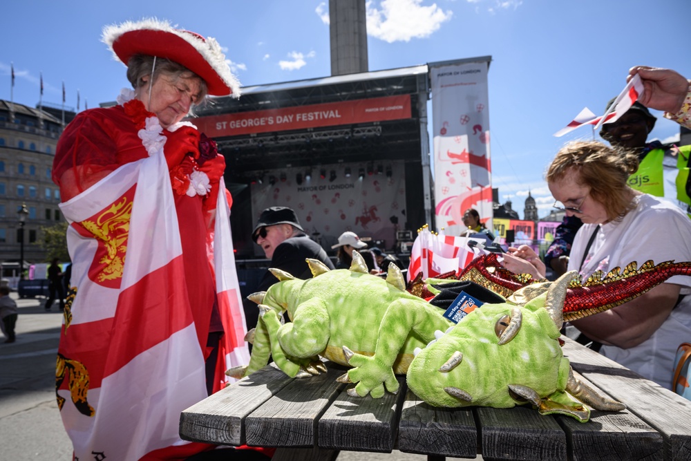 A woman assembles her St George and dragon costume during the St George's Day celebrations in Trafalgar Square (Getty)