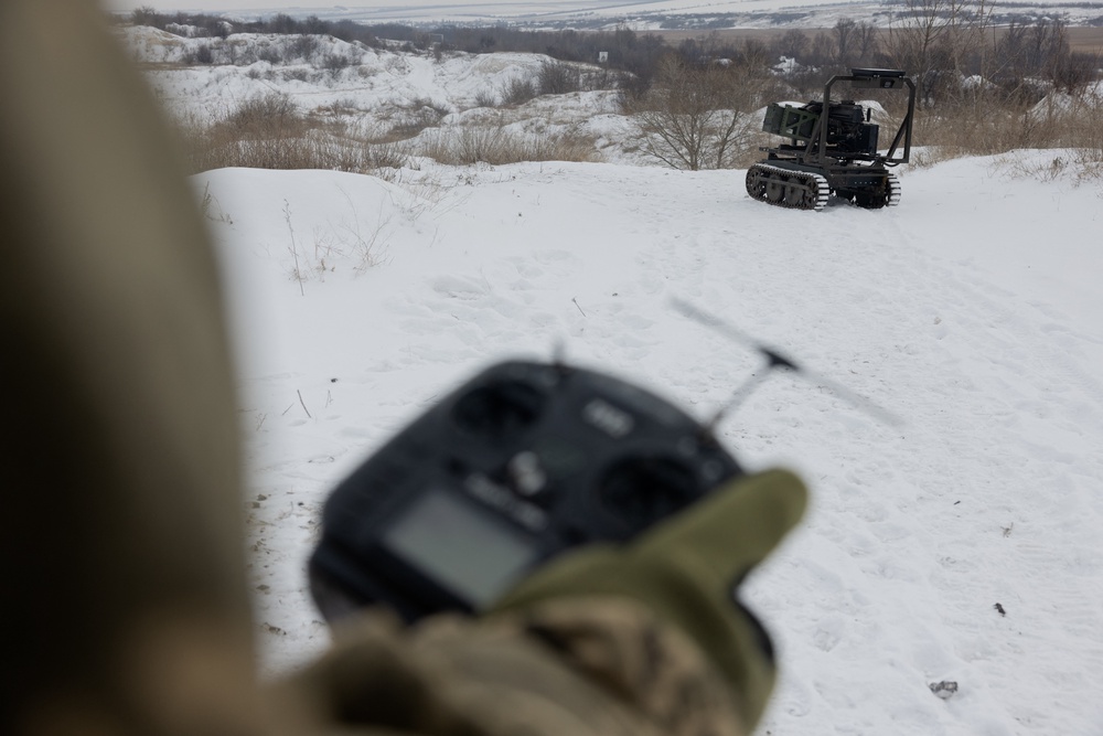 A Ukrainian serviceman tests an unmanned robotic ground vehicle armed with an Mk 19 grenade launcher (AFP/Getty)