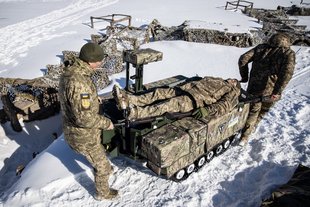 Soldiers demonstrate how the Tencore Unmanned Ground Vehicle (UGV) TerMIT is used for evacuation procedures (Getty)