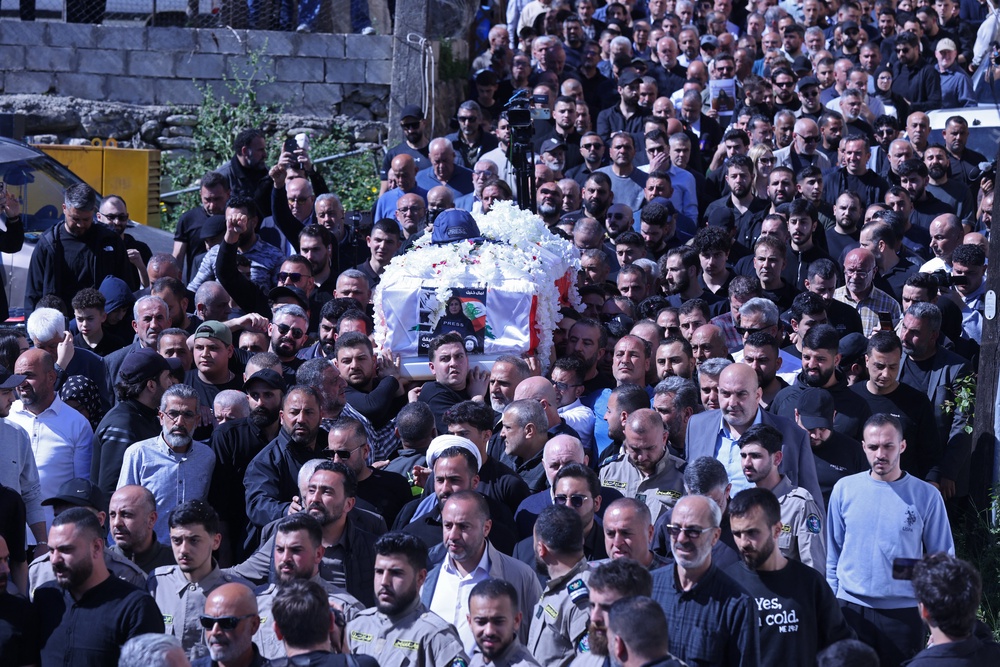 Mourners carry Khalil’s coffin during her funeral procession in Bissariye town, south of Sidon, on 23 April (AFP/Getty)