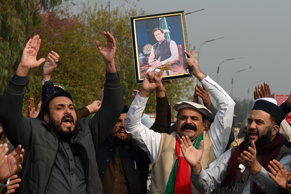 Supporters protest to demand Khan’s release (AFP/Getty)