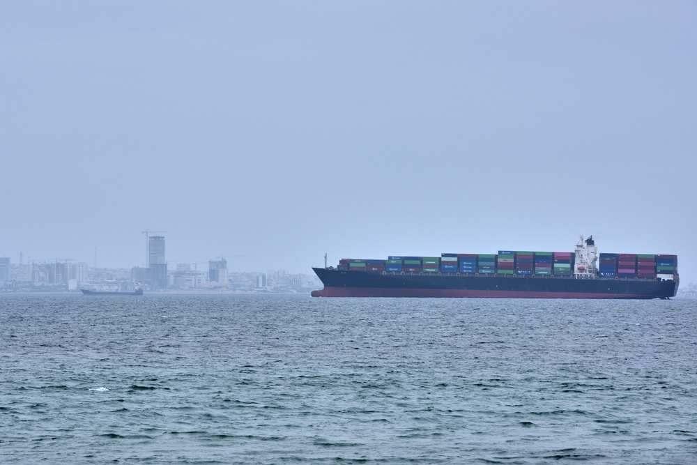 A container ship is seen in the Strait of Hormuz off the coast of Qeshm Island, Iran, Saturday, April 18, 2026. (AP Photo/Asghar Besharati) (Copyright 2026 The Associated Press. All rights reserved)