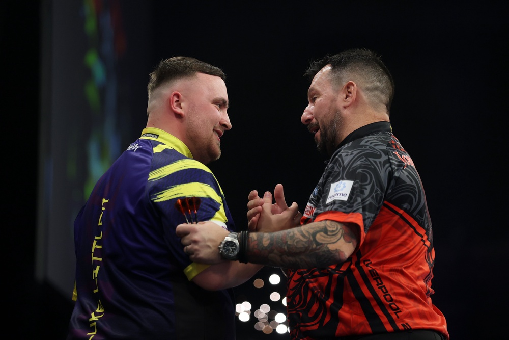 Luke Littler and Jonny Clayton shake hands after the final match (Getty)