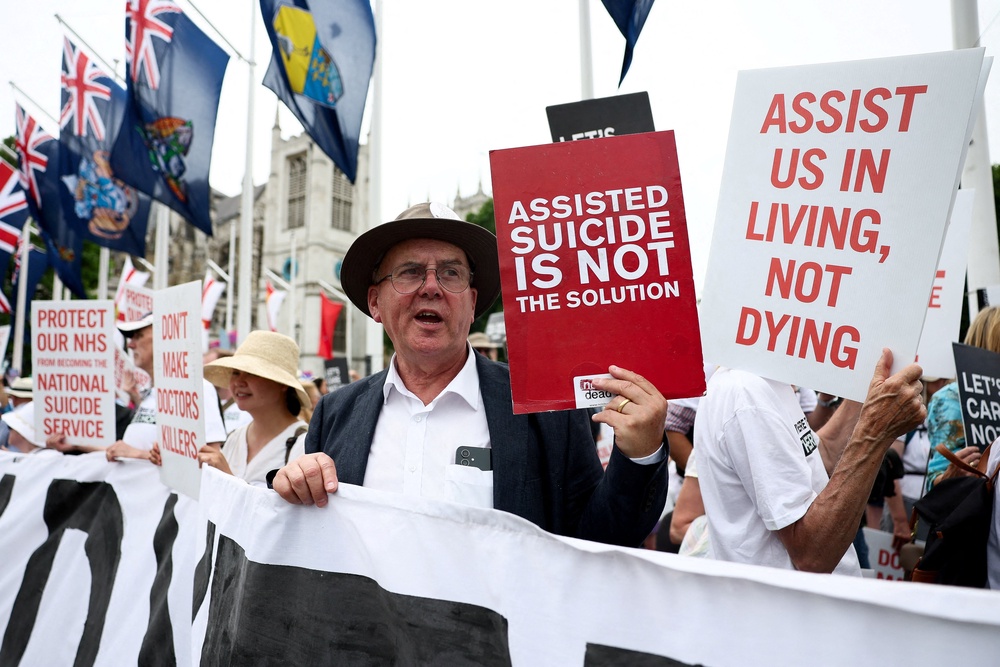 Demonstrators protest against the assisted dying law for terminally ill people (Reuters)