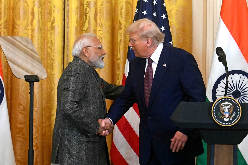 Donald Trump shakes hands with Narendra Modi at the White House (AFP/Getty)