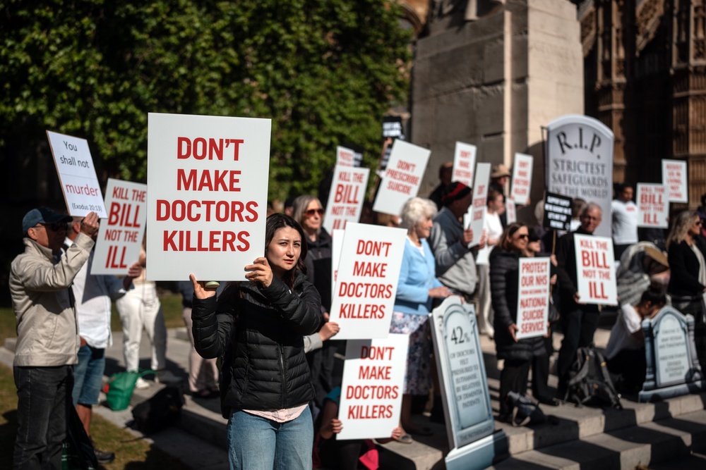 People take part in a demonstration against assisted dying on May 16, 2025 in London, England (Getty)