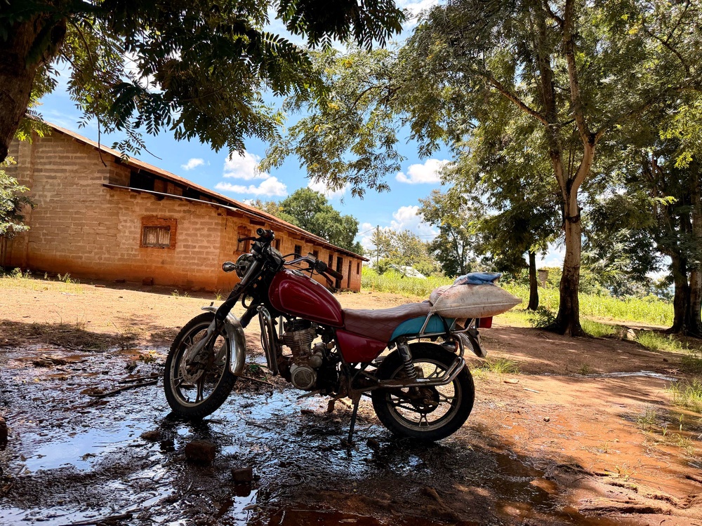 Motorcycles are a critical economic lifeline to the outside world - so Mwavi took a big hit when the village’s motorcycle mechanic died from malaria (Nick Ferris)
