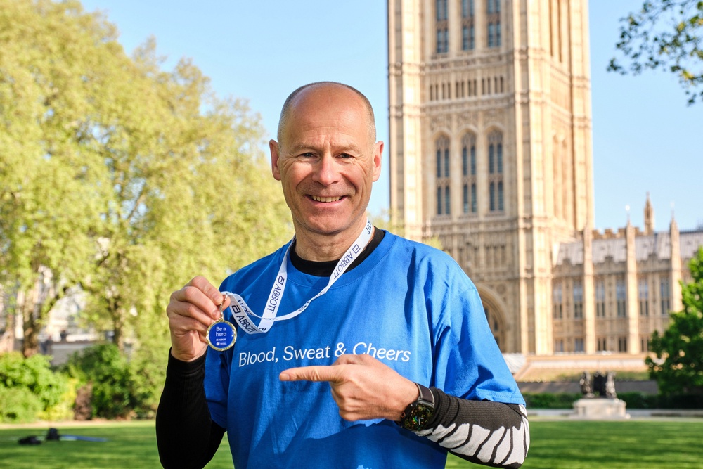 Hugh Brasher, chief executive of London Marathon Events, shows off the medal available to the first 200 people to sign up to be a blood donor as part of the Blood, Sweat and Cheers campaign (Michael Leckie/PA Media Assignments) (PA Wire)