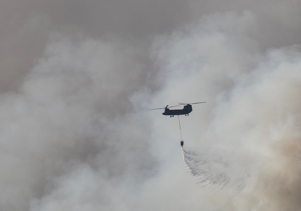 A Japan Self Defense Force helicopter drops water on the head of the fire near the town of Otsuchi in Iwate Prefecture (AFP/Getty)