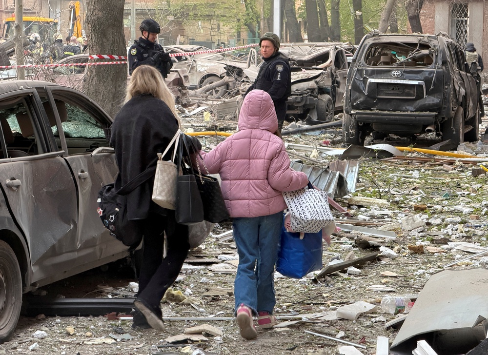 Residents leave the site of an apartment building hit by a Russian drone and missile strike, amid Russia's attack on Ukraine, in Dnipro, Ukraine April 25, 2026. (Reuters)