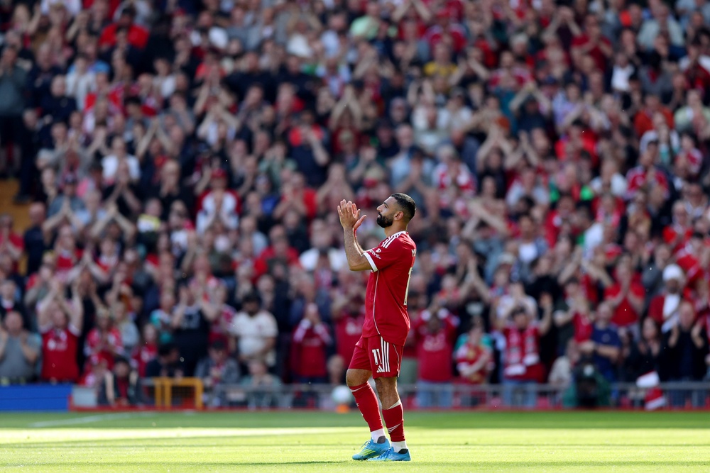 Salah applauds the Anfield crowd as he leaves the field (Getty)