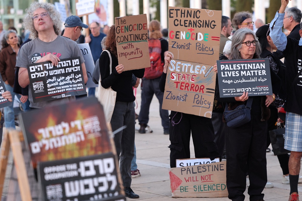 Israeli left-wing activists demonstrate in HaBima Square against the ongoing war with Iran and against the Israeli government, and against the Jewish settler violence in the Israeli-occupied Palestinian West Bank, in Tel Aviv (AFP/Getty)
