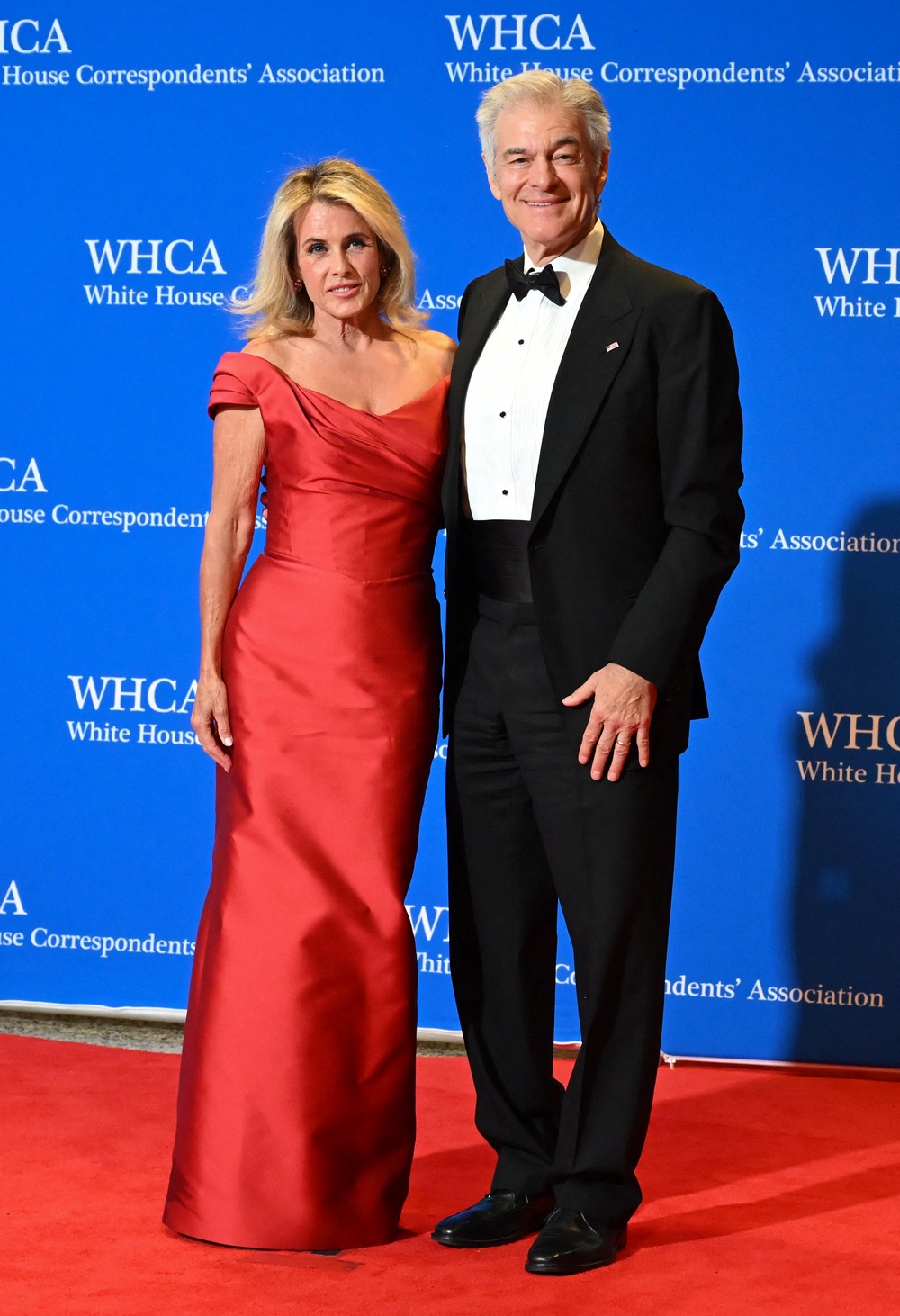 Oz, a surgeon and former TV personality, brought his wife, Lisa Oz, a former actress (AFP via Getty Images)