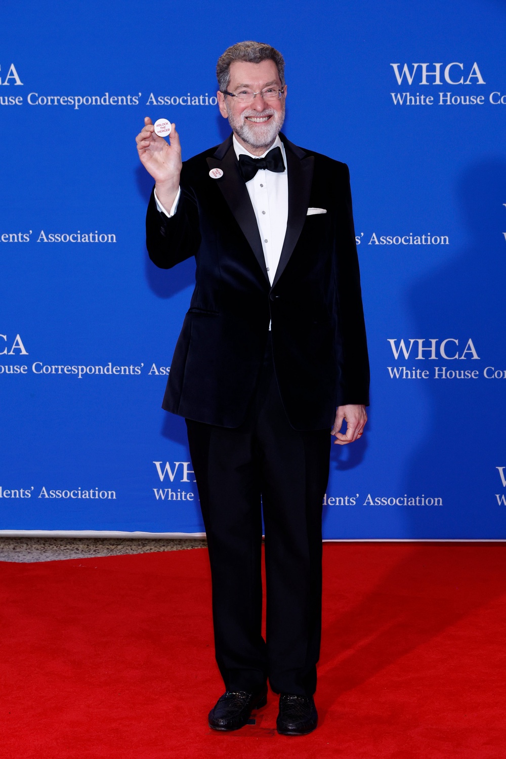 The small pin read: '#Block the merger' (Getty Images)