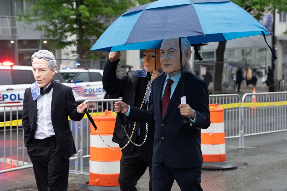 A handful of demonstrators wore masks of US and Israeli politicians. One appeared to be wearing a mask of Jeffrey Epstein (Getty Images)