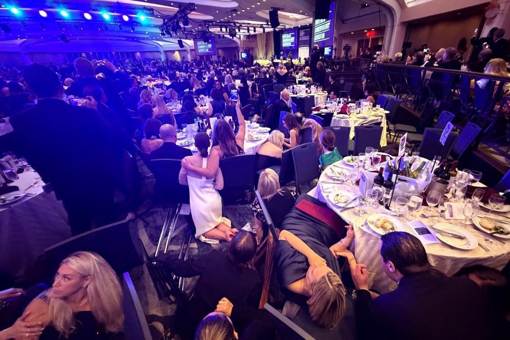 Members of the media take cover after a shooter opened fire at the White House Correspondents’ Dinner. A Secret Service agent who was shot was the only reported injury (Reuters)