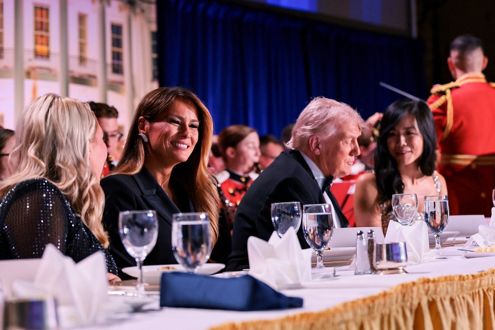 The president and first lady at the dinner before the incident (Reuters)