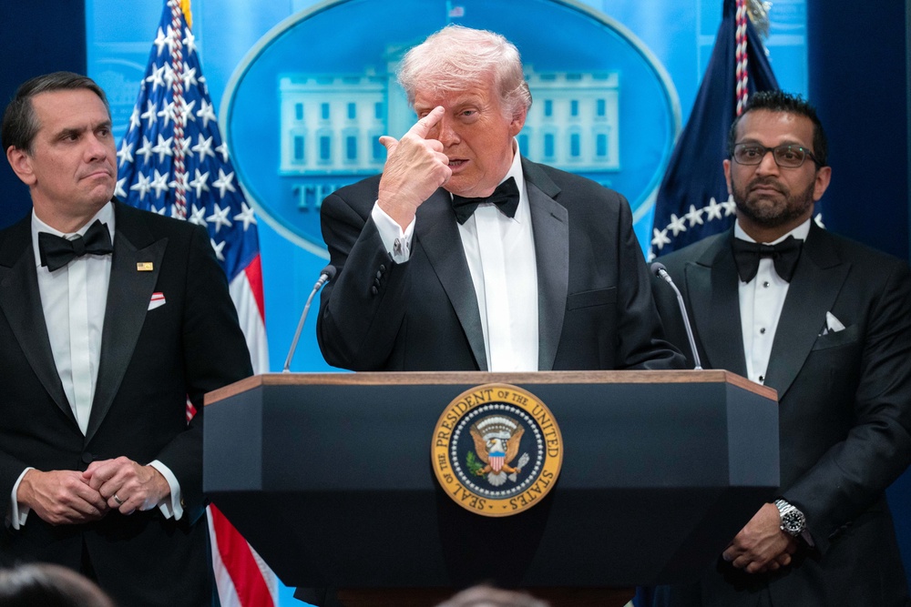 President Donald Trump gestures as he speaks during a press conference in the White House after the dinner (Jose Luis Magana/AP) (AP)