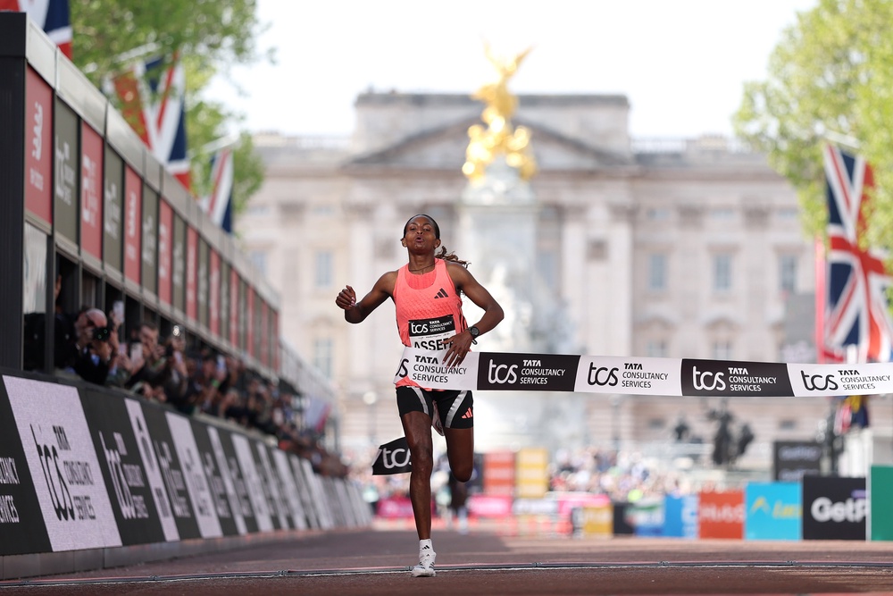 Tigst Assefa celebrates crossing the line and winning with a new World Record time during the Women’s 2026 TCS London Marathon (Getty)