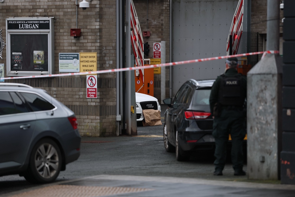 A white Audi car parked inside the police station in Lurgan, Co Armagh after a delivery driver was threatened at gunpoint and forced to drive with an object inside to the town’s police station, sparking a security alert (Liam McBurney/PA) (PA Wire)