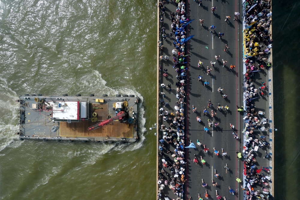 An aerial view of runners crossing Tower Bridge as a barge passes underneath (Jonathan Brady/PA) (PA Wire)