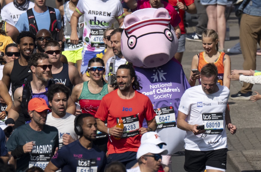Joe Wicks is running alongside Daddy Pig (Benjamin Gilbert/London Marathon Events/PA) (PA Media)