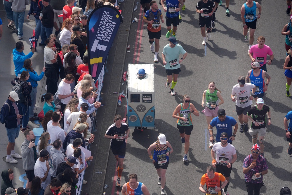 A runner crossing Tower Bridge in a cardboard VW costume (Jonathan Brady/PA) (PA Wire)