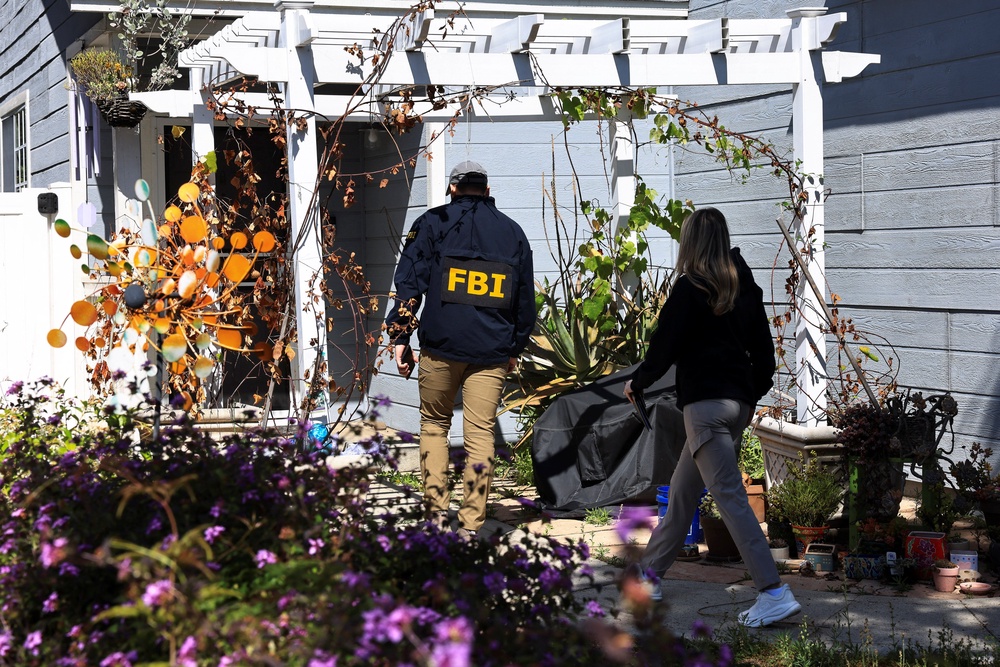 FBI agents photographed at the home associated with the 31-year-old man accused of attacking the White House Correspondents’ Dinner (Reuters)