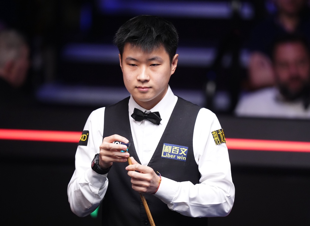 Defending champion Zhao Xintong beat Ding Junhui (Mike Egerton/PA) (PA Wire)