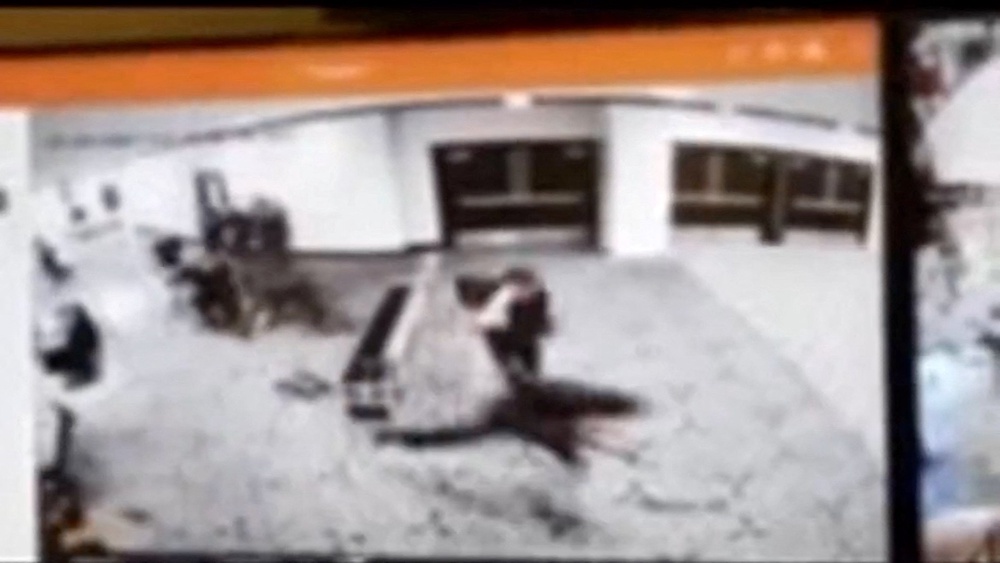 Video posted by Trump showed the shooting suspect running past a security checkpoint (via REUTERS)